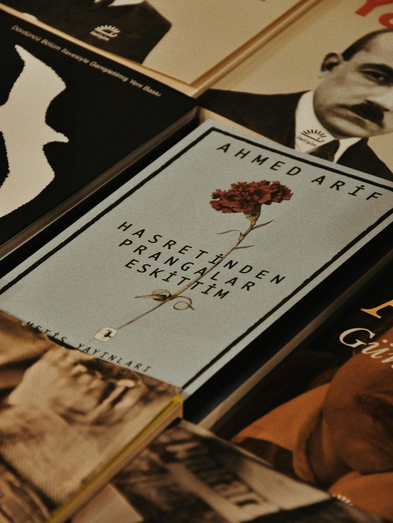 A collection of literary books with a focus on the work of Ahmed Arif, featuring historical themes.